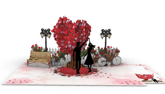 Romantic Couple Dancing Under Heart Tree
